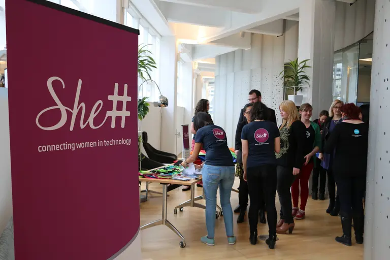 Attendees gathered beside a She Sharp 'connecting women in technology' banner at the Wellington launch with Xero.