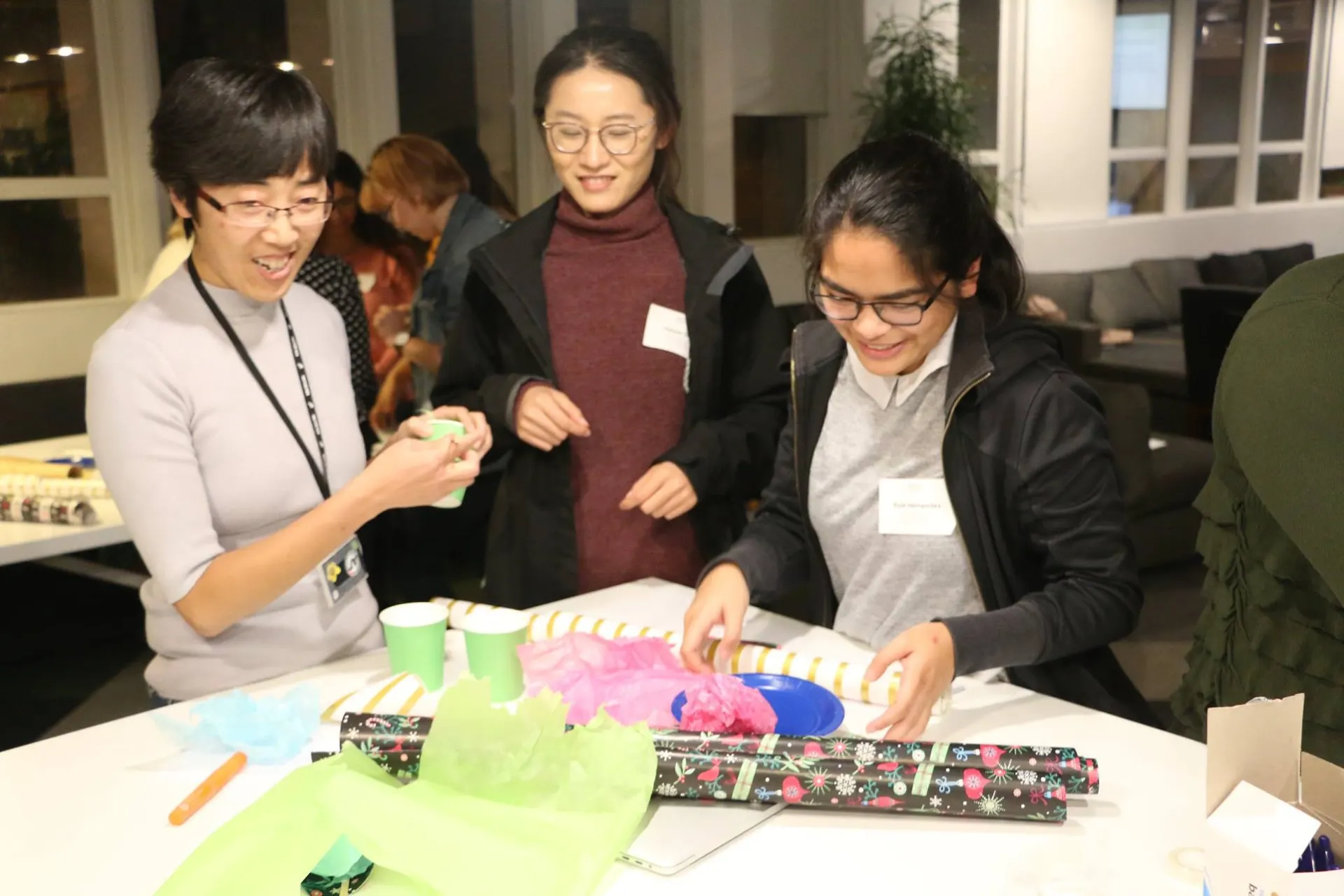 Participants working hands-on with craft materials during a She Sharp workshop activity.